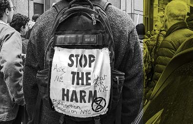 a person with a sign that says stop the harm